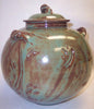 A mint green Shino glaze that breaks to brown where thinner. One of our most popular glazes! Amaranth Stoneware Canada.