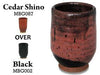 Cedar Shino glaze, variegated reddish-brown that breaks over texture, often with a lacquer-like finish. Amaranth Stoneware Canada