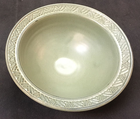 Deep Avocado glaze, a bright green finish with a slight satiny sheen, suitable for indoor and outdoor tile and functional ware. Amaranth Stoneware Canada.