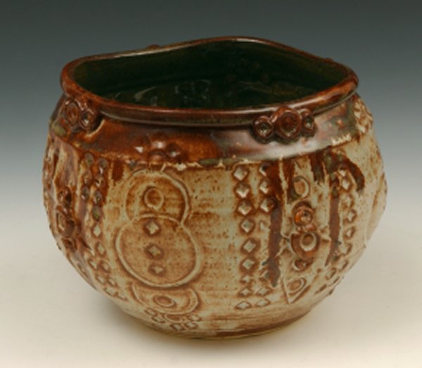 A light brown Shino with cream tones, breaking darker over texture. Satin finish, user-friendly, and great over textures! Amaranth Stoneware Canada.