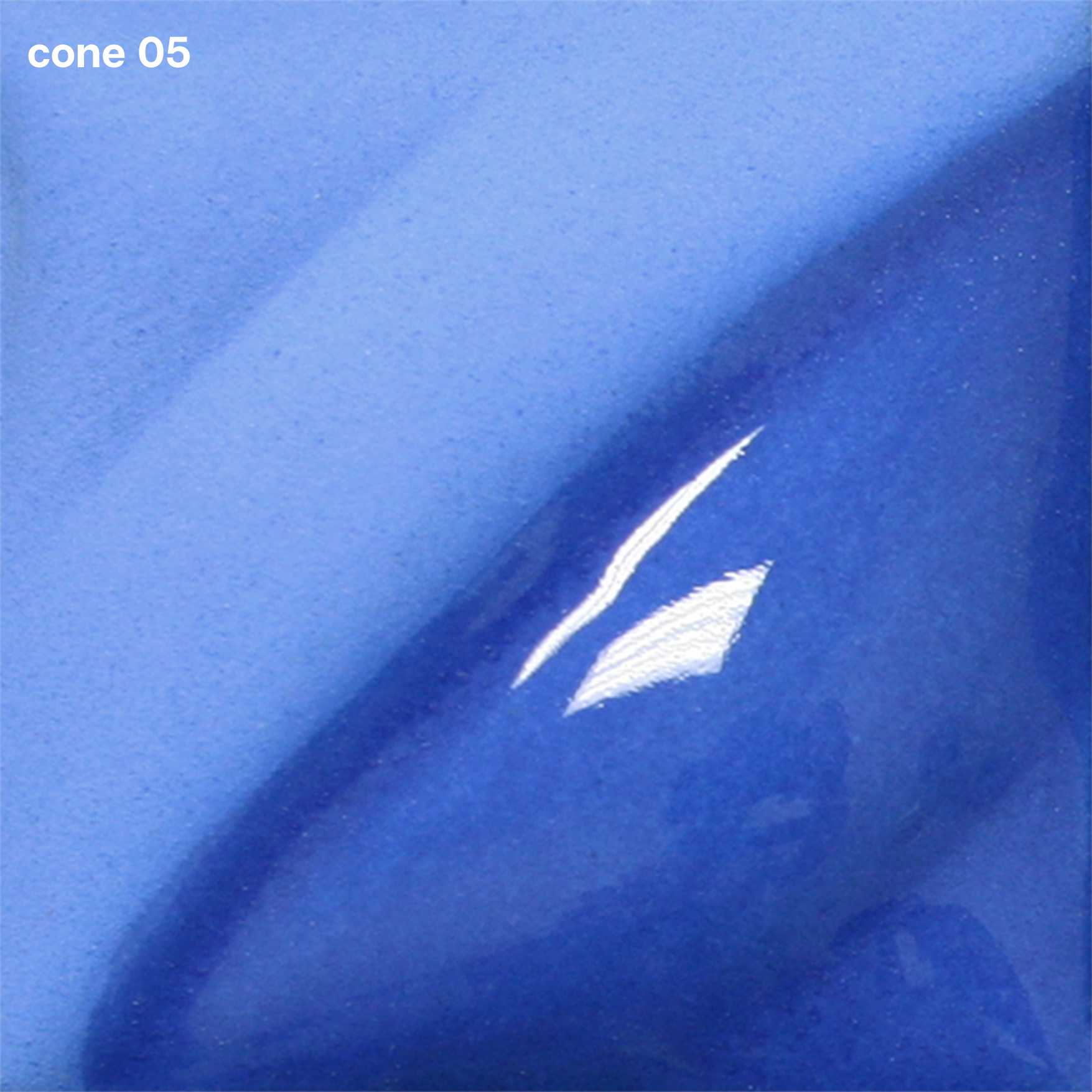 Medium Blue Velvet Underglaze is a vivid primary blue that darkens at Cone 5 and maintains its hue. Clear glaze darkens color. Amaranth Stoneware Canada.