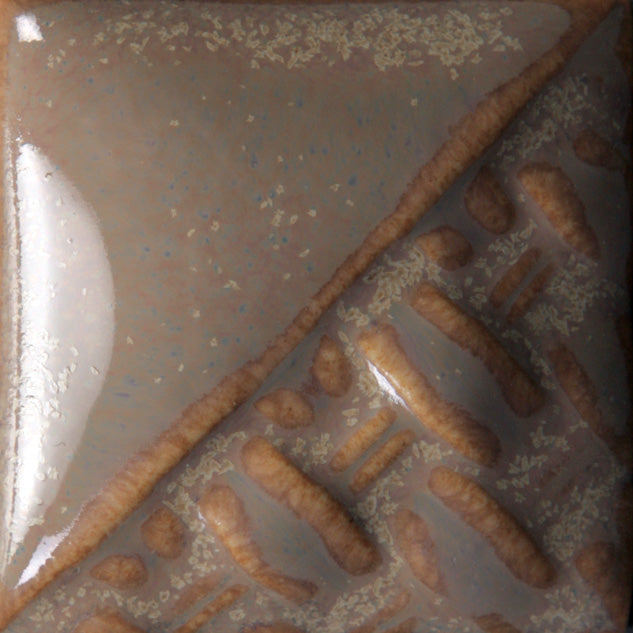 Oyster variegated cream/brown glaze with gray/purple undertones at Cone 6; breaks brown.
At Cone 10: Color changes to variegated brown/cream with increased movement. Amaranth Stoneware Canada.