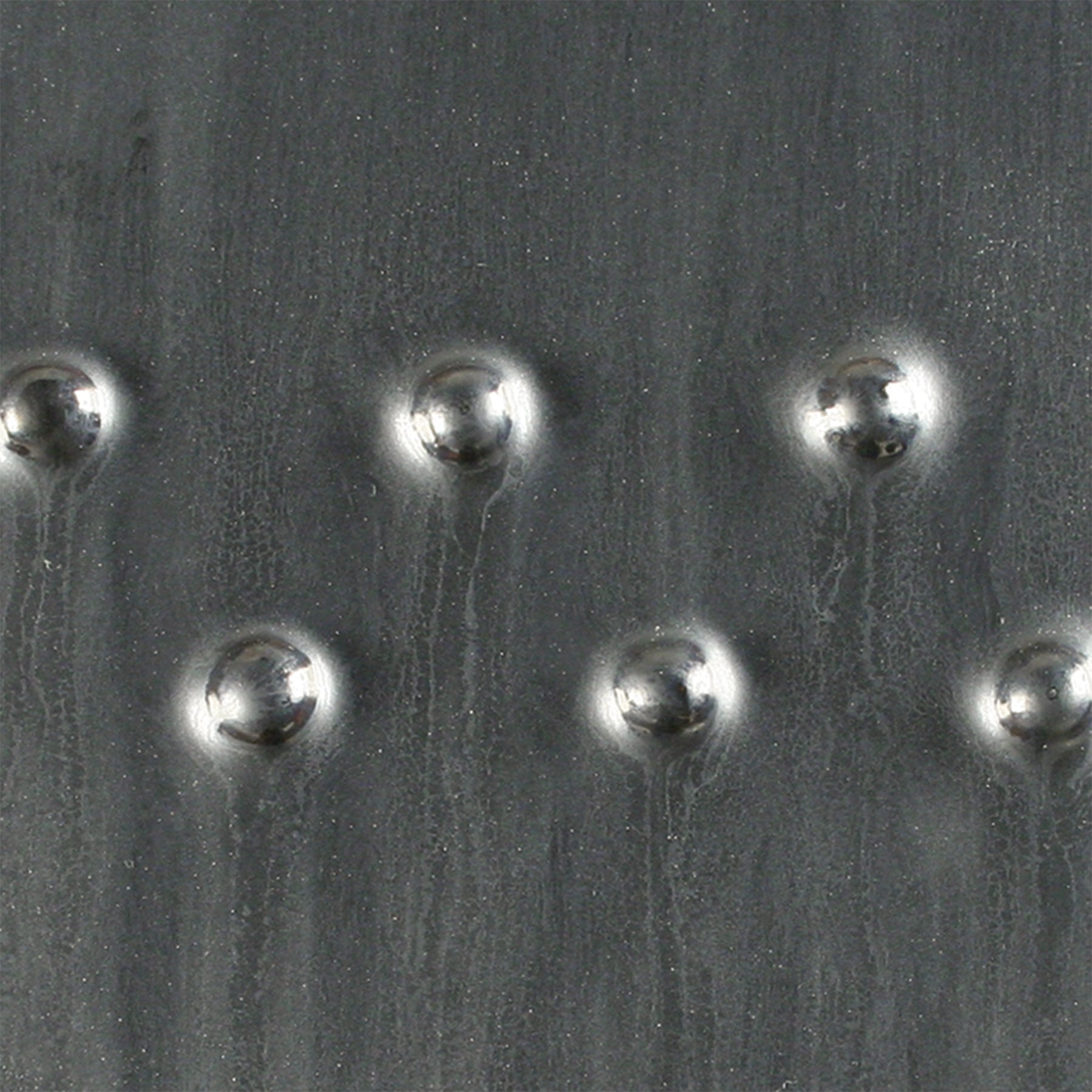Saturation Metallic is a satin metallic black glaze that resembles steel and other metals. Amaranth Stoneware Canada.