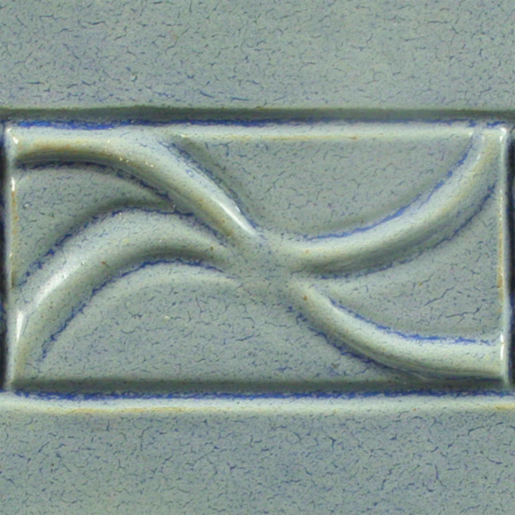 Frosted Turquoise is an opaque gray-blue glaze that appears to crackle over deep blue but has a smooth, satiny surface. Amaranth Stoneware Canada.