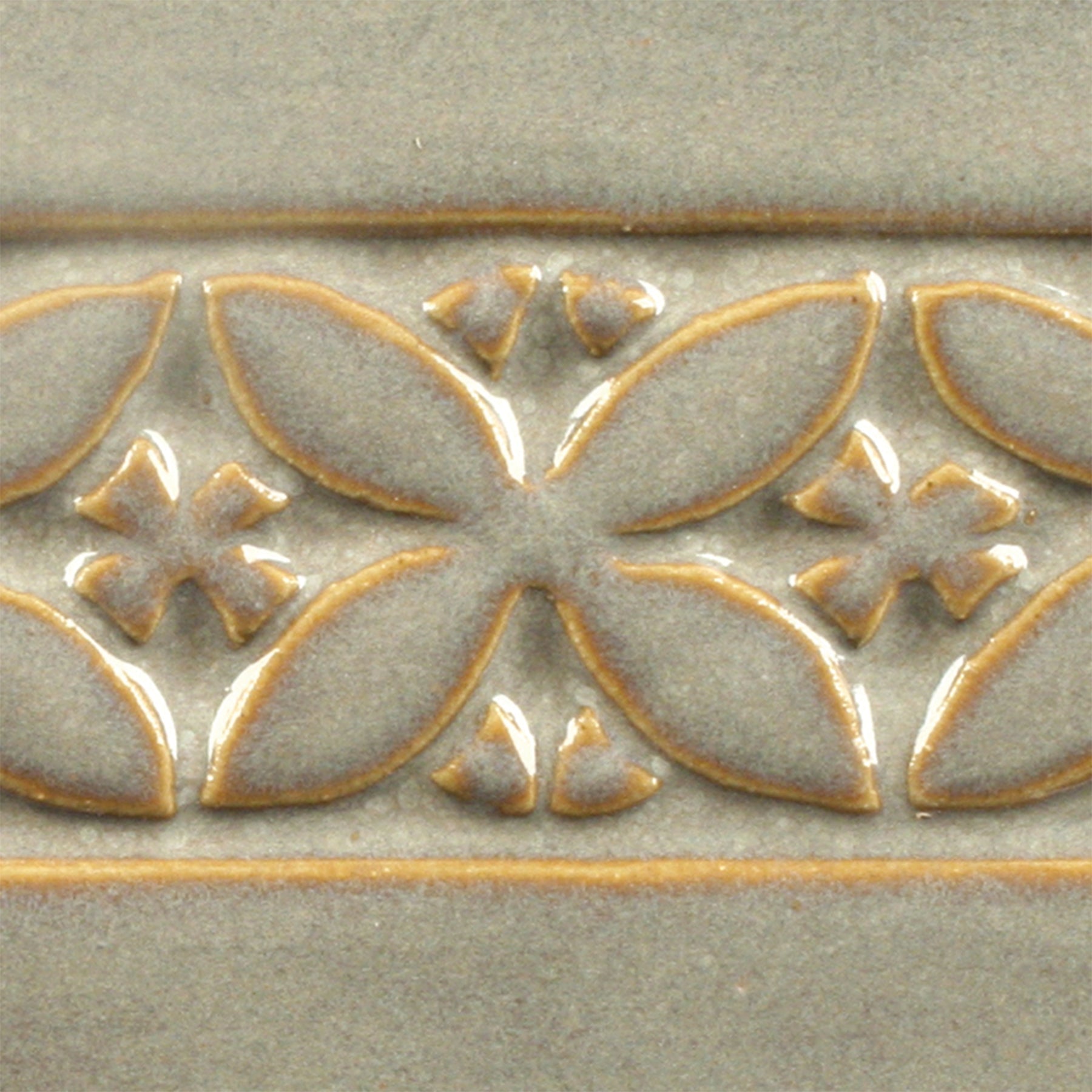 Light Sepia is an opalescent grey glaze that features strong variations on textured ware. Amaranth Stoneware Canada.