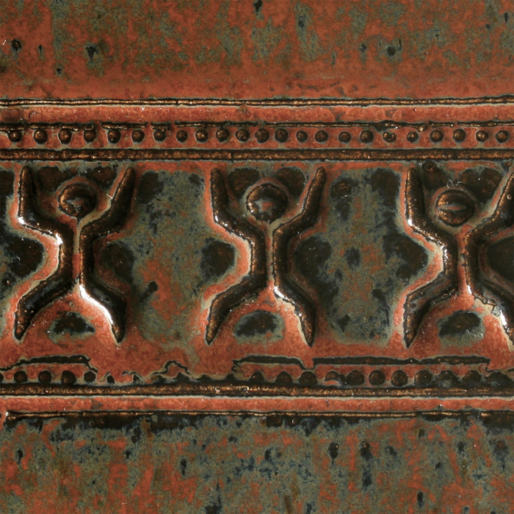 Ancient Jasper is a fluid, opaque glaze that transitions from soft black to olive green to rust red as it is applied thicker. Amaranth Stoneware Canada.