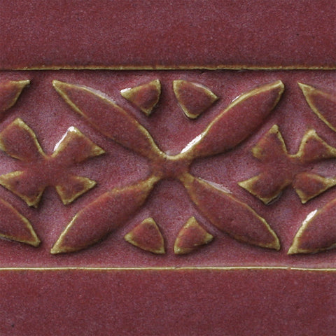 Chun Plum is a pink-red translucent glaze that breaks light tan over textures. Amaranth Stoneware Canada.