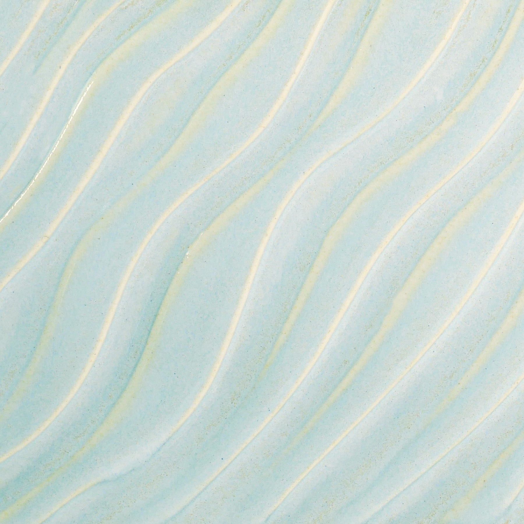 Glossy pale blue Cloud glaze, breaking on texture with peachy float, perfect for layering. Amaranth Stoneware Canada.