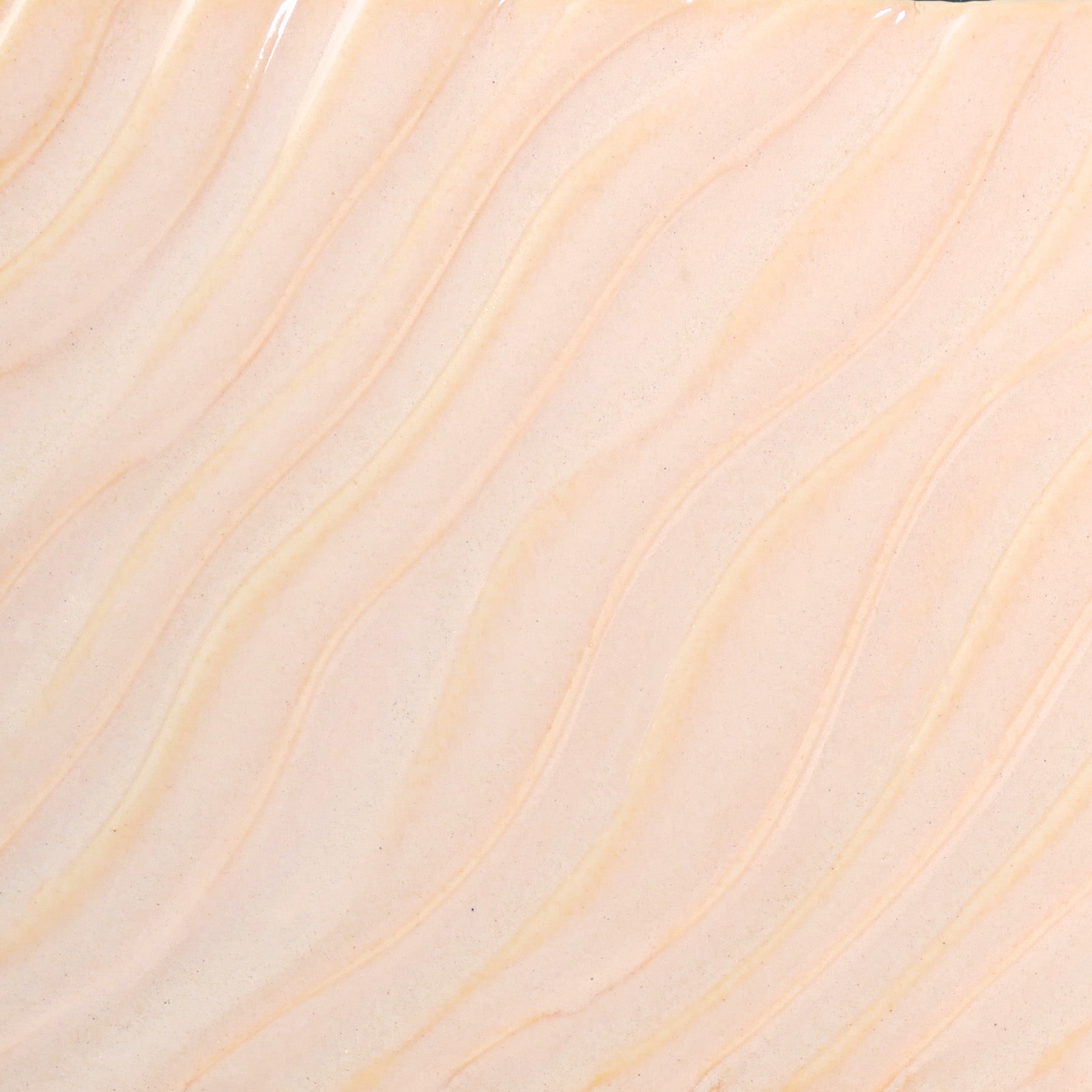 Glossy pale pink Flower glaze, breaking on texture with peachy float, perfect for layering. Amaranth Stoneware Canada.