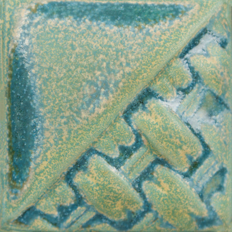 Riptide satin-matte, opaque turquoise/green glaze at Cone 6; breaks over texture, glossy where thick or pooling.
At Cone 10: Shifts to gray with white/turquoise pixelization, glaze remains stable. Amaranth Stoneware Canada.