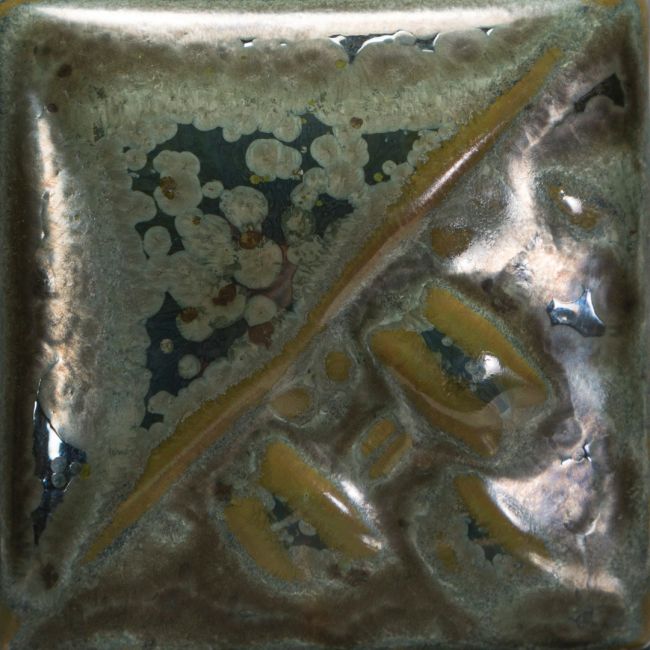 Cone 6: Speckled Toad is a shimmery green with dark grey specks that bloom, breaking to a semi-transparent olive green.
Cone 10: Color changes to olive green/metallic gray, breaking blue. Amaranth Stoneware Canada.