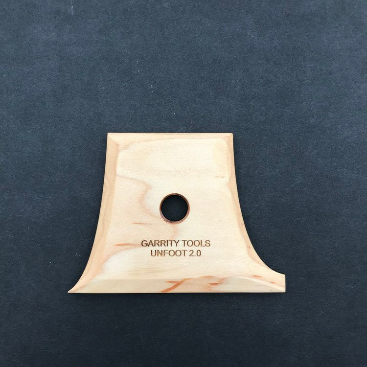 Unfoot 2 lifts your vessel with curved sides, a point and flat edge to undercut clay while preserving wall shape. 4.25" x 3.25", made of maple wood. Handmade in St. Louis, MO. Amaranth Stoneware Canada.