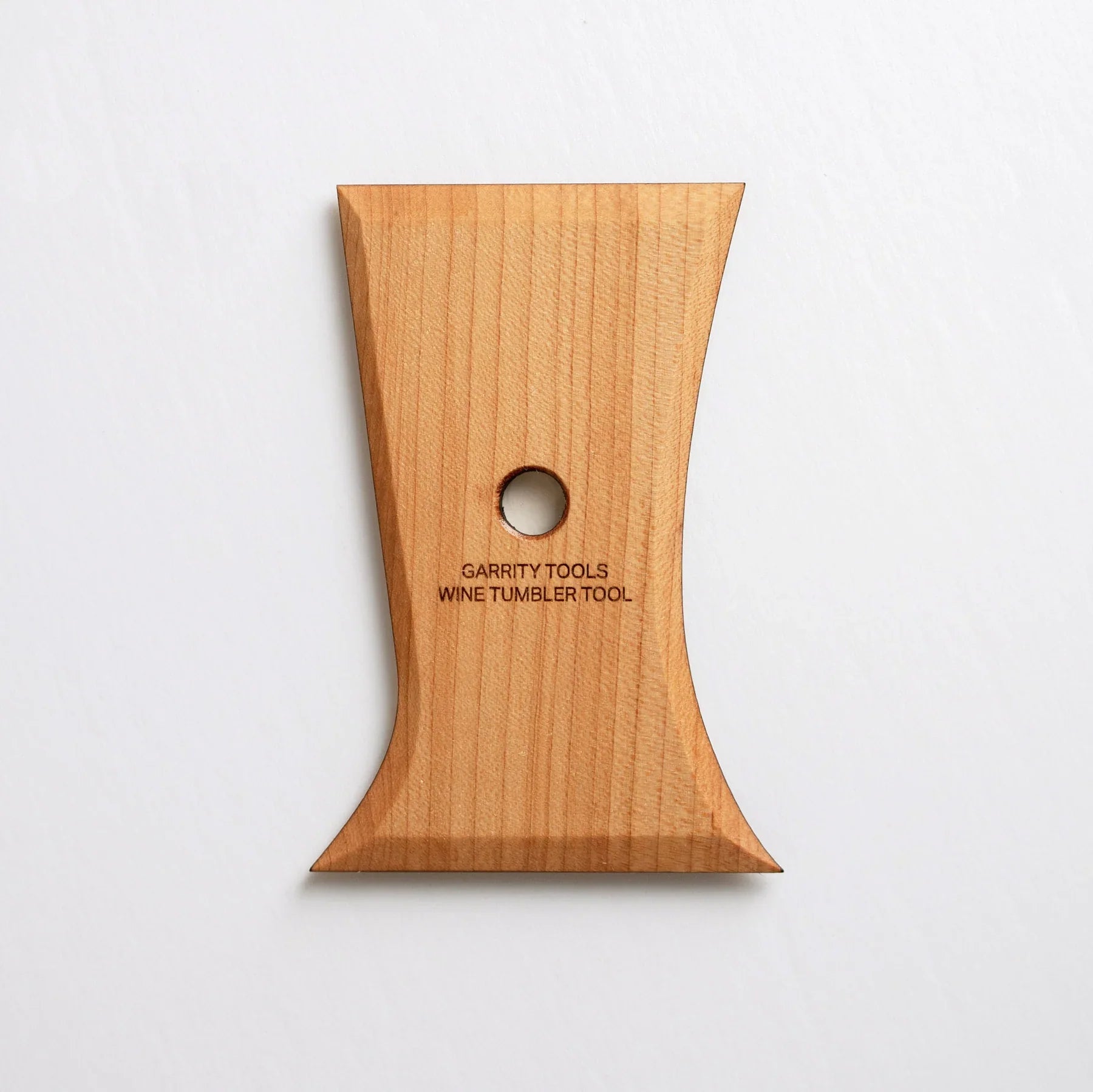 The Wine Tumbler Tool shapes perfect stemless wine glasses with two curved sides for red, white, or bubbles. 5” x 3.5”, made of maple wood. Handmade in St. Louis, MO. Amaranth Stoneware Canada.