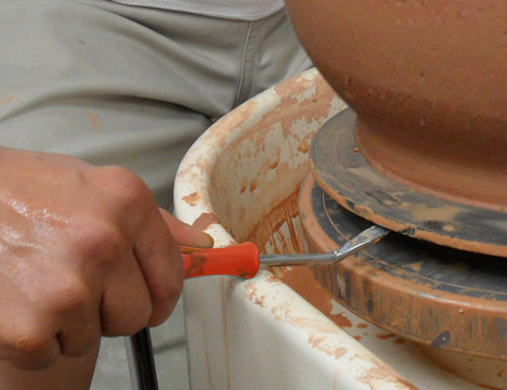 The Bat Lifter prevents broken nails, needle tools, and fettling knives. It helps potters confidently remove sticky bats or heavy wheel-throwing work from the wheel head. Amaranth Stoneware Canada.