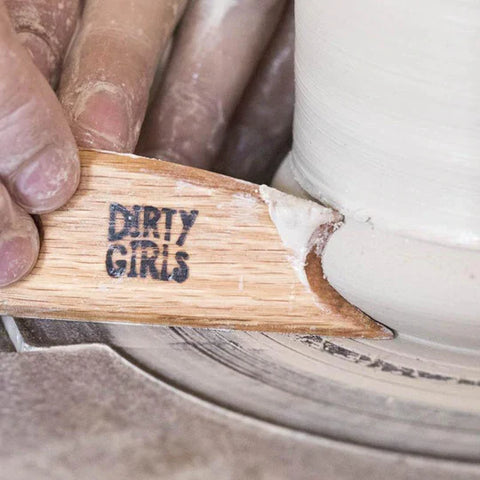 Big Foot Fetish Rib, a versatile wooden tool with beveled edges for controlled finishing on rims and galleys. Ideal for shaping and creating a foot for trimming. Amaranth Stoneware Canada.