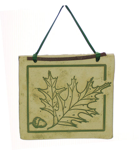 Handcrafted 4x4-inch stoneware Botanicals featuring seasonal plants and creatures. Finished with dogwood and ribbon. Weatherproof. Handcrafted in Kingston, Ontario at Amaranth Stoneware.