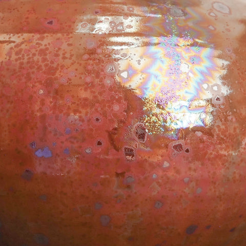 Mars Crystal is a highly fluid, dark brick red glaze with silvery, iridescent crystals. Opaque and breaks darker. Amaranth Stoneware Canada.