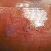 Mars Crystal is a highly fluid, dark brick red glaze with silvery, iridescent crystals. Opaque and breaks darker. Amaranth Stoneware Canada.