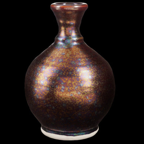 Dark Star is a fluid, dark matte glaze with iridescent crystals like a beetle shell. Breaks translucent. Amaranth Stoneware Canada.