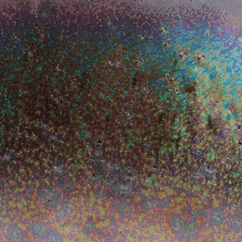Dark Star is a fluid, dark matte glaze with iridescent crystals like a beetle shell. Breaks translucent. Amaranth Stoneware Canada.