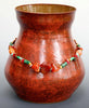 Cedar Shino glaze, variegated reddish-brown that breaks over texture, often with a lacquer-like finish. Amaranth Stoneware Canada