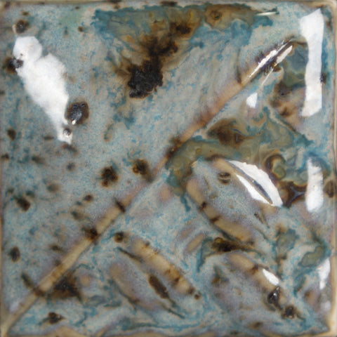 Cone 6: Semi-opaque sky blue gloss glaze with melting brown crystals; base color darkens, and crystals become darker and more defined at Cone 10. Amaranth Stoneware Canada.