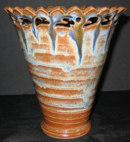 Cinnamon Stick glaze, rich glossy brown that develops a bluish haze when thick. Amaranth Stoneware Canada.