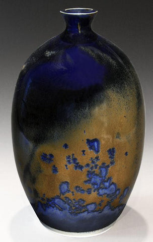 Crystal Lagoon glaze, a dramatic blend of deep cobalt blue where thick and brown where thin, with large blue crystals forming when slow cooled. Amaranth Stoneware Canada.