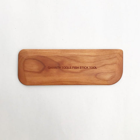 Fishstick Tool with four corner profiles and flat sides for compressing and pulling clay. Keeps projects clean, centered, and smooth. 5