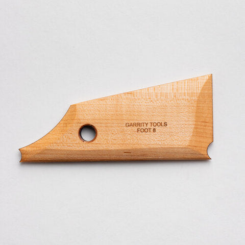 
Foot 8 tool with a simple curve and straight edge for creating rounded feet. Flat bottom for stability and shaping while spinning. 5