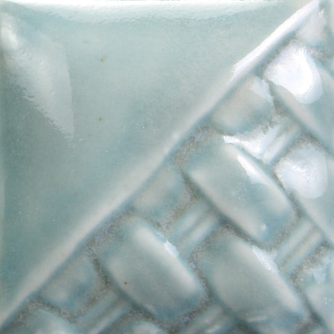 Cone 6: Transparent gloss deepens with three coats, revealing designs. Cone 10: Lightens and becomes more transparent. Amaranth Stoneware Canada.