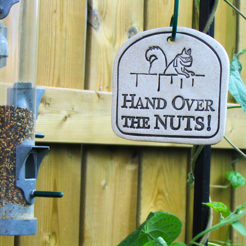 Handcrafted 4x3.5-inch weatherproof stoneware plaques with rustproof 14.5-inch hangers. Handcrafted in Kingston, Ontario at Amaranth Stoneware.