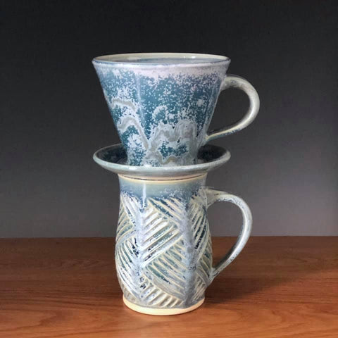 A runny pale blue glaze with icy blue crystals, especially when slow-cooled. Beautiful but requires care. Amaranth Stoneware Canada.