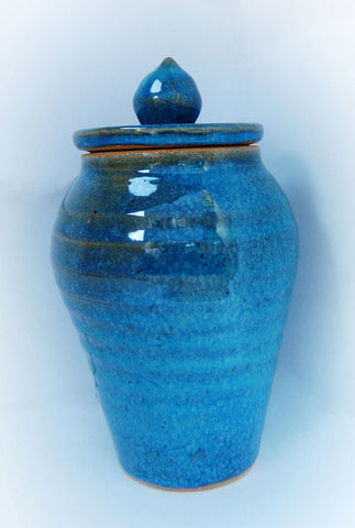 A bright electric blue glaze with slight translucency when thin, developing a deep mottled look over black. Amaranth Stoneware Canada.