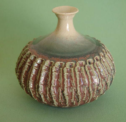 Eggplant glaze, a dynamic finish that transitions from matte purple to glossy green with intense blue crystals when slow-cooled. Amaranth Stoneware Canada.