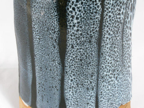 A Texas Two-Step undercoat that creates a mottled glossy black on its own. Designed for oilspot effects. Amaranth Stoneware Canada.