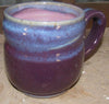 A deep, dark purple glaze that offers a solid, unbreaking finish, perfect for both decorative and practical uses. Amaranth Stoneware Canada.