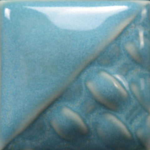 
Norse Blue semi-opaque blue gloss glaze with shades of light blue and green at Cone 6; thicker coats create more homogenous color.
At Cone 10: Color darkens. Amaranth Stoneware Canada.