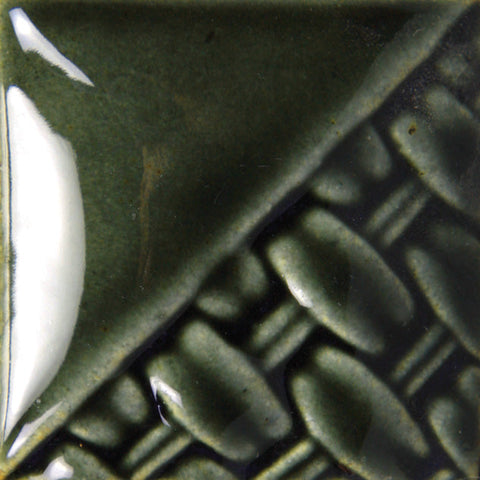 Northern Woods semi-transparent bluish-green glaze at Cone 6; lighter coats produce translucent green with brown hues, deepens with more coats.
At Cone 10: No change. Amaranth Stoneware Canada.






