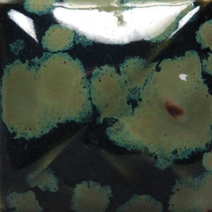 Olive Float dark green gloss glaze with light green crystals at Cone 6; mimics crystalline glazes without complex kiln programming.
At Cone 10: Color changes to red, crystals remain. Amaranth Stoneware Canada.






