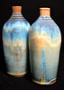 Orion is a signature glaze from the Constellation Series, transitioning from brown to bronze and blue, with golden crystals in slow cooling. Amaranth Stoneware Canada.