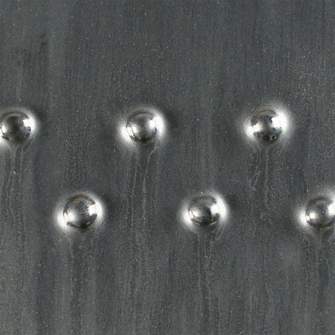 Saturation Metallic is a satin metallic black glaze that resembles steel and other metals. Amaranth Stoneware Canada.