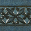 Blue Midnight is a glossy black glaze with blue highlights in thick areas, ideal for textured work and layering. Amaranth Stoneware Canada.