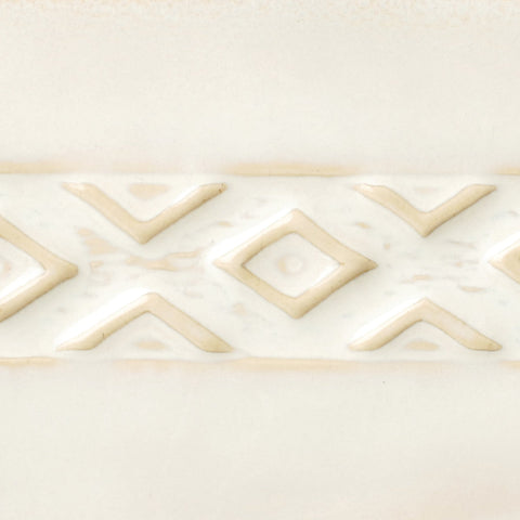 Honey Flux is a creamy glaze that boosts flow over layers, becoming honey-cream at Cone 5 and fluid white with honey flecks at Cone 6. Amaranth Stoneware Canada.