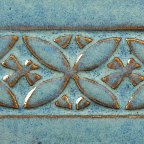 Blue Rutile is a flowing blue glaze that breaks to brown on thinner areas, ideal for texture and layering. Amaranth Stoneware Canada.
