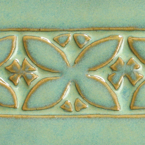 A subtle turquoise gloss, green-beige where thin, and beautiful aqua where thick. Great for textured ware and layering. Amaranth Stoneware Canada.