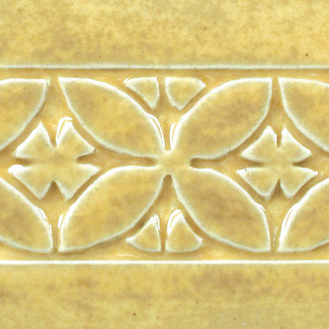 Oatmeal is a toasty, light yellow glaze that is relatively opaque and breaks clear over textured surfaces. Amaranth Stoneware Canada.