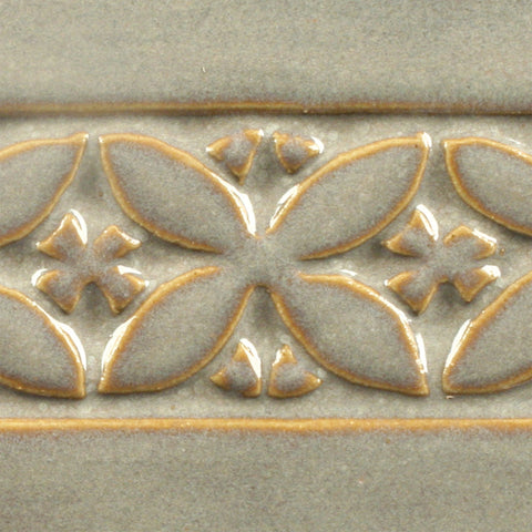 Light Sepia is an opalescent grey glaze that features strong variations on textured ware. Amaranth Stoneware Canada.