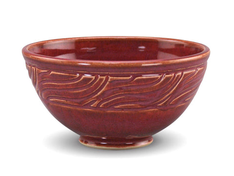 Chun Plum is a pink-red translucent glaze that breaks light tan over textures. Amaranth Stoneware Canada.