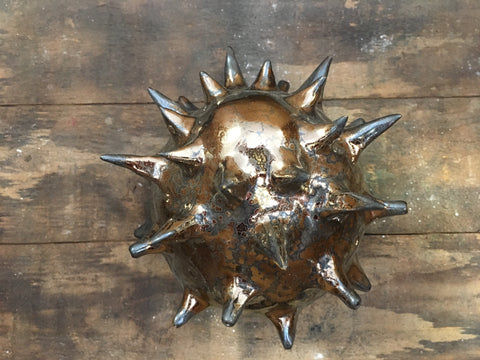 Vintage Gold glaze, glossy metallic with gold crystals and dark haloes, no break over texture. Amaranth Stoneware Canada.